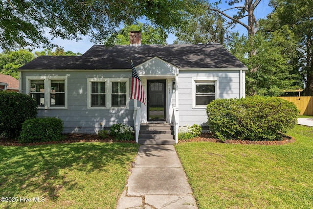 822 Chattawka Ln, New Bern, NC 28560 - bungalow with crawl space, a chimney, and roof with shingles