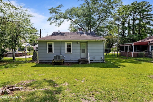 822 Chattawka Ln, New Bern, NC 28560 - rear view of property featuring entry steps, central AC unit, and a chimney