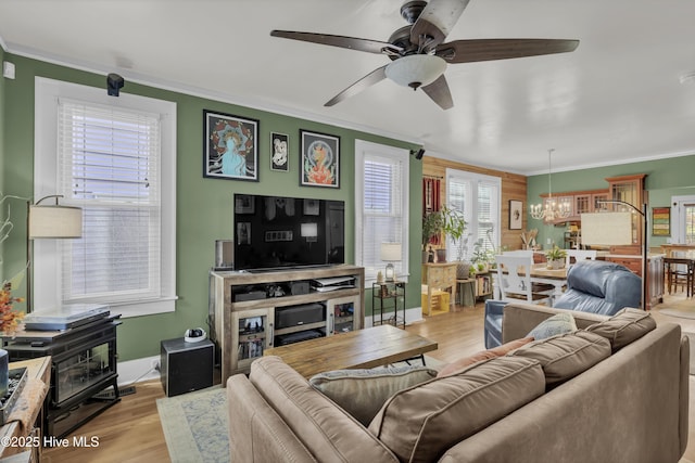 2008 Market St, Wilmington, NC 28403 - living area with a chandelier, crown molding, a ceiling fan, and light wood-style floors