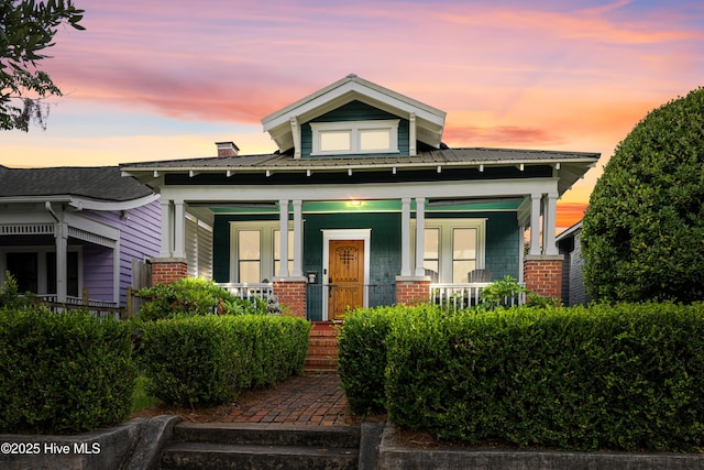 2008 Market St, Wilmington, NC 28403 - view of front of house featuring covered porch and brick siding