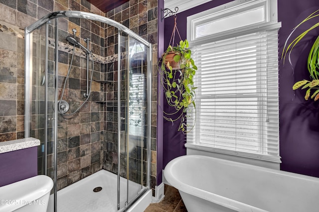 2008 Market St, Wilmington, NC 28403 - full bath with a soaking tub, healthy amount of natural light, and a stall shower