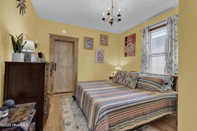 2008 Market St, Wilmington, NC 28403 - bedroom with a chandelier and wood-type flooring