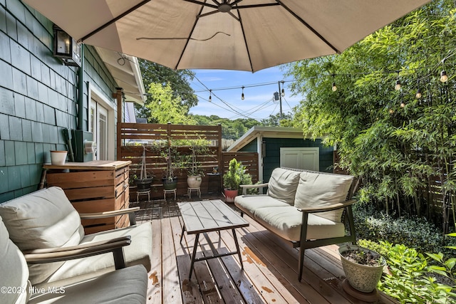 2008 Market St, Wilmington, NC 28403 - deck featuring an outdoor living space and a shed