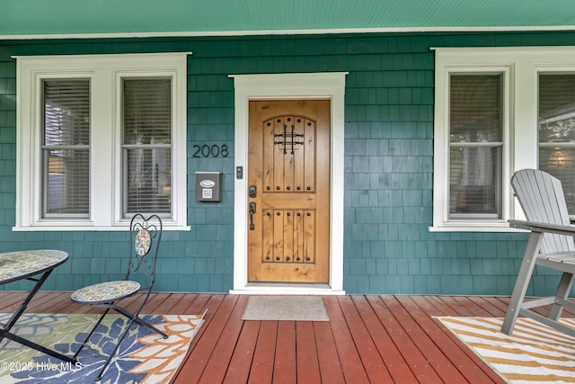 2008 Market St, Wilmington, NC 28403 - doorway to property featuring covered porch