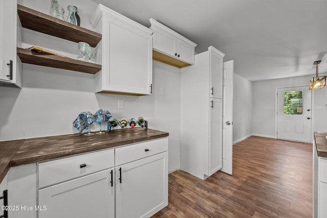 1496 Kellum Loop Rd, Jacksonville, NC 28546 - kitchen featuring dark wood-style flooring, open shelves, white cabinets, and butcher block counters
