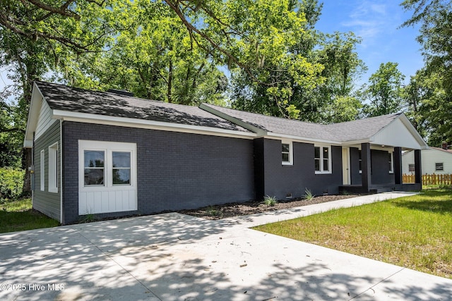 1496 Kellum Loop Rd, Jacksonville, NC 28546 - ranch-style home featuring brick siding, a front lawn, roof with shingles, and crawl space