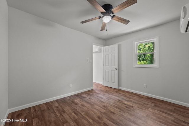 1496 Kellum Loop Rd, Jacksonville, NC 28546 - empty room with baseboards, wood finished floors, ceiling fan, and a wall mounted AC