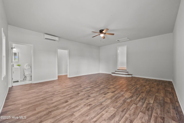 1496 Kellum Loop Rd, Jacksonville, NC 28546 - unfurnished room with a wall mounted air conditioner, wood finished floors, ceiling fan, and baseboards