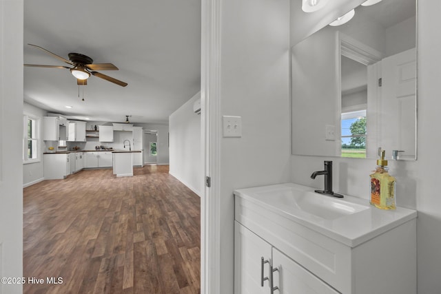 1496 Kellum Loop Rd, Jacksonville, NC 28546 - bathroom featuring a ceiling fan, wood finished floors, vanity, and baseboards