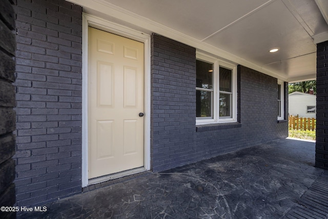 1496 Kellum Loop Rd, Jacksonville, NC 28546 - doorway to property with a porch and brick siding