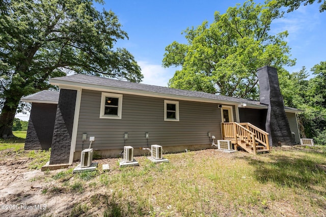 1496 Kellum Loop Rd, Jacksonville, NC 28546 - rear view of house featuring a chimney and central air condition unit