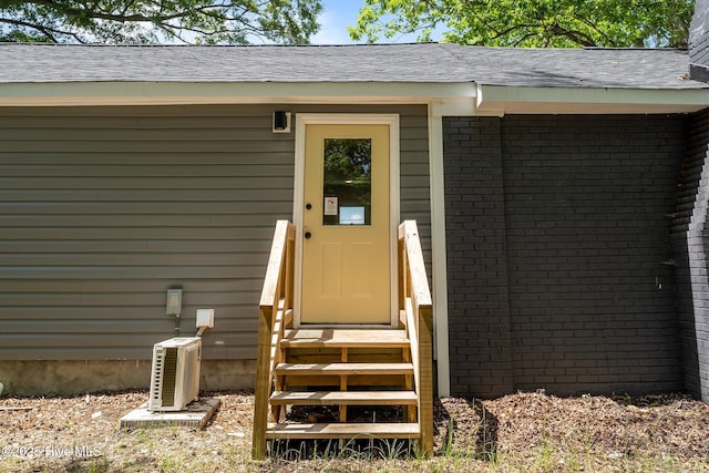 1496 Kellum Loop Rd, Jacksonville, NC 28546 - view of exterior entry featuring brick siding
