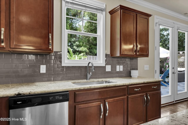 133 Overlook Dr, Wilmington, NC 28411 - kitchen with stainless steel dishwasher, crown molding, healthy amount of natural light, backsplash, and light stone countertops
