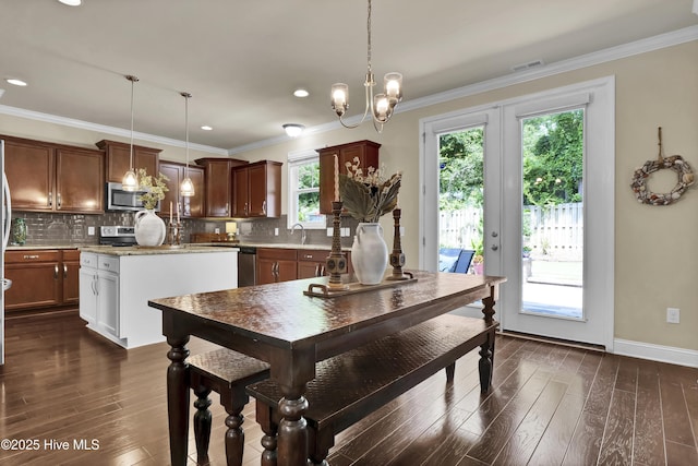 133 Overlook Dr, Wilmington, NC 28411 - dining room with dark wood-style floors, crown molding, a chandelier, and recessed lighting