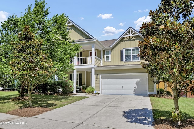 133 Overlook Dr, Wilmington, NC 28411 - view of front of home with board and batten siding, a balcony, a garage, and a front yard