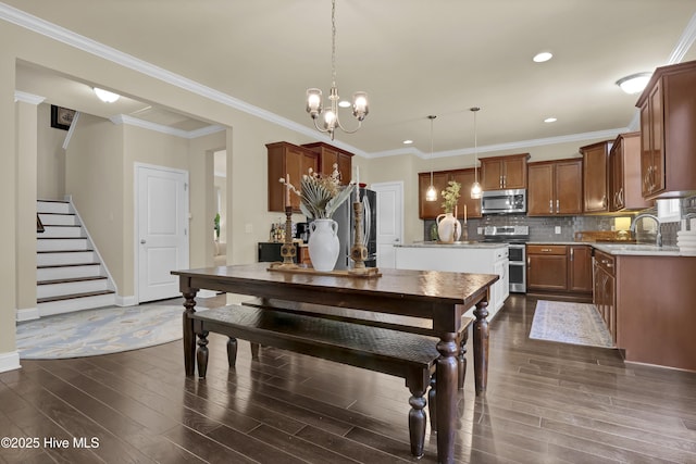 133 Overlook Dr, Wilmington, NC 28411 - dining area with dark wood-style flooring, stairs, a chandelier, recessed lighting, and crown molding