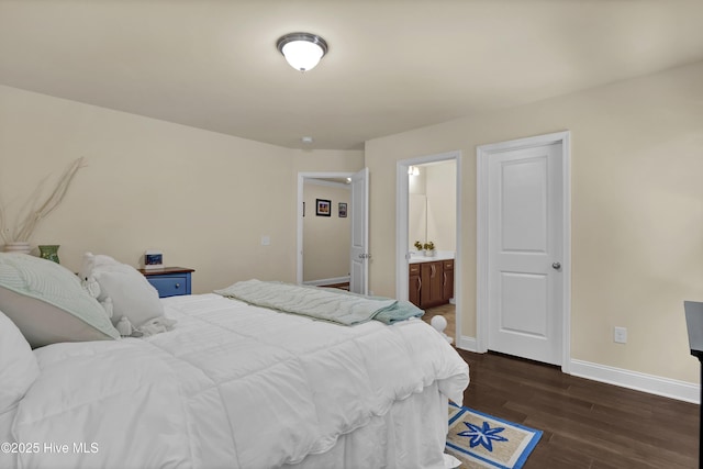 133 Overlook Dr, Wilmington, NC 28411 - bedroom featuring dark wood-style flooring and connected bathroom