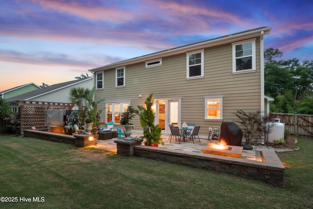 133 Overlook Dr, Wilmington, NC 28411 - back of property featuring a fire pit and a patio area