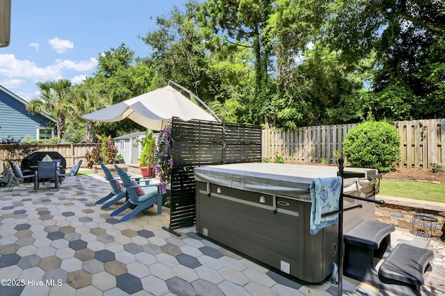 133 Overlook Dr, Wilmington, NC 28411 - fenced backyard with a hot tub, a patio area, outdoor dining area, and a storage shed