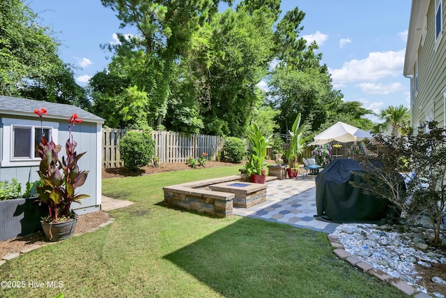 133 Overlook Dr, Wilmington, NC 28411 - fenced backyard featuring a patio area and a fire pit