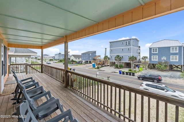 210 W Beach Dr, Oak Island, NC 28465 - wooden deck with a residential view