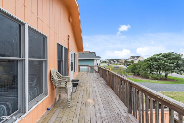 210 W Beach Dr, Oak Island, NC 28465 - wooden terrace featuring a residential view
