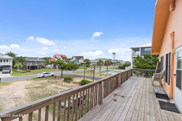 210 W Beach Dr, Oak Island, NC 28465 - wooden deck featuring a residential view