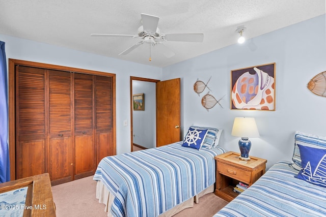 210 W Beach Dr, Oak Island, NC 28465 - carpeted bedroom with a closet and ceiling fan