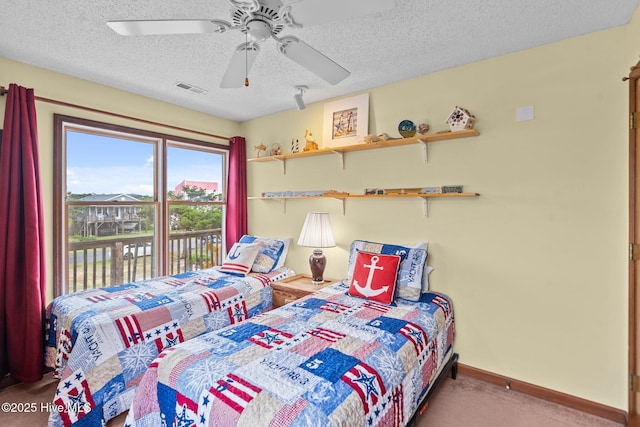 210 W Beach Dr, Oak Island, NC 28465 - carpeted bedroom with a textured ceiling, access to outside, and ceiling fan