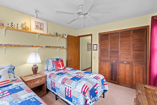 210 W Beach Dr, Oak Island, NC 28465 - carpeted bedroom with a closet, a ceiling fan, and a textured ceiling
