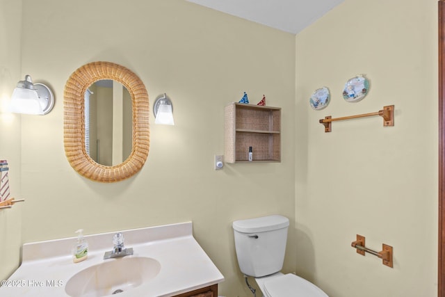 210 W Beach Dr, Oak Island, NC 28465 - bathroom with vanity and toilet