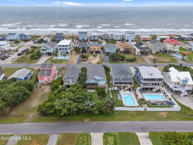 210 W Beach Dr, Oak Island, NC 28465 - aerial view of residential area featuring a pool and a nearby body of water