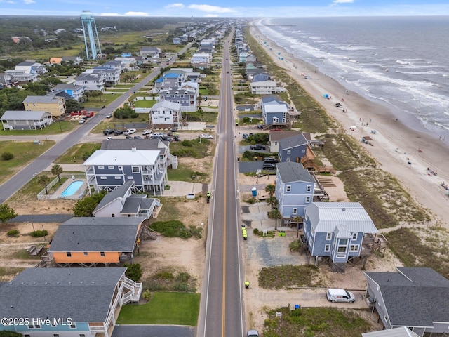 210 W Beach Dr, Oak Island, NC 28465 - aerial perspective of suburban area featuring waterfront with a beach
