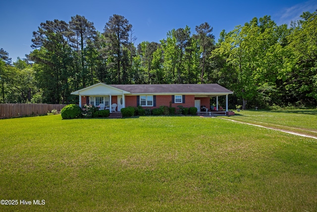 4173 Middle Rd, Trenton, NC 28585 - single story home with covered porch, brick siding, and a carport