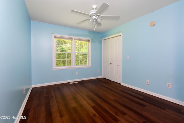 4173 Middle Rd, Trenton, NC 28585 - unfurnished bedroom with dark wood-type flooring, a closet, and ceiling fan