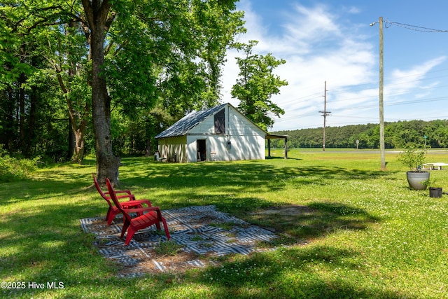 4173 Middle Rd, Trenton, NC 28585 - view of green lawn with a pole building and an outdoor structure