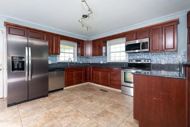 4173 Middle Rd, Trenton, NC 28585 - kitchen featuring stainless steel appliances, backsplash, dark stone countertops, and light tile patterned floors