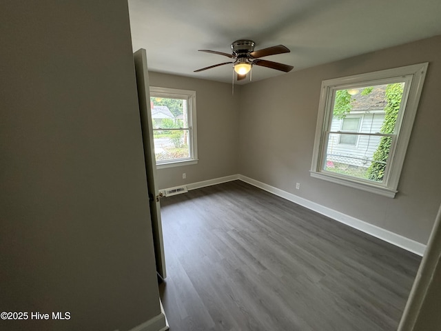 1310 Washington St E, Wilson, NC 27893 - unfurnished room featuring dark wood-style flooring and a ceiling fan