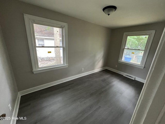 1310 Washington St E, Wilson, NC 27893 - spare room with dark wood finished floors and baseboards