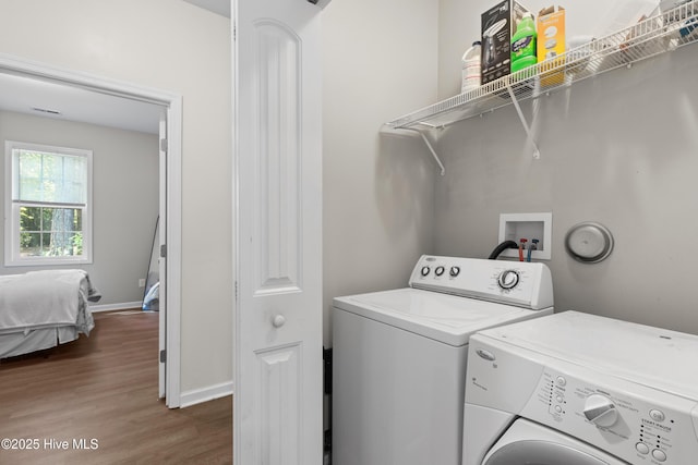 5709 Burgaw Hwy, Maple Hill, NC 28454 - washroom featuring separate washer and dryer and dark wood finished floors
