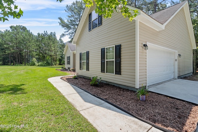 5709 Burgaw Hwy, Maple Hill, NC 28454 - view of side of home with a garage, roof with shingles, a lawn, and driveway