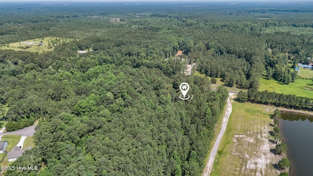 5709 Burgaw Hwy, Maple Hill, NC 28454 - aerial view of property and surrounding area featuring a heavily wooded area and a nearby body of water