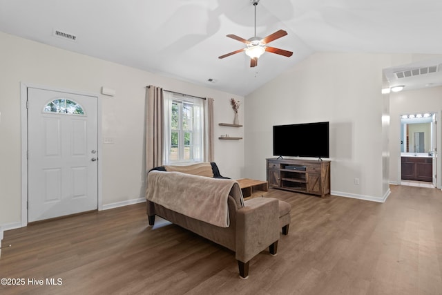 5709 Burgaw Hwy, Maple Hill, NC 28454 - living area featuring wood finished floors, a ceiling fan, and vaulted ceiling