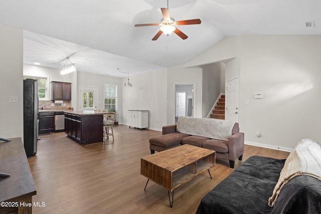 5709 Burgaw Hwy, Maple Hill, NC 28454 - living room with ceiling fan, wood finished floors, stairway, and lofted ceiling