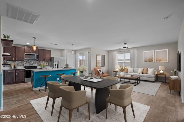 694 Chester Way NE, Leland, NC 28451 - dining space featuring light wood-type flooring, ceiling fan, and recessed lighting