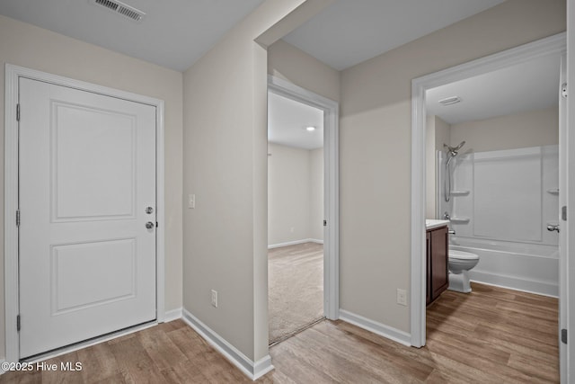 694 Chester Way NE, Leland, NC 28451 - foyer with light wood-style floors and baseboards