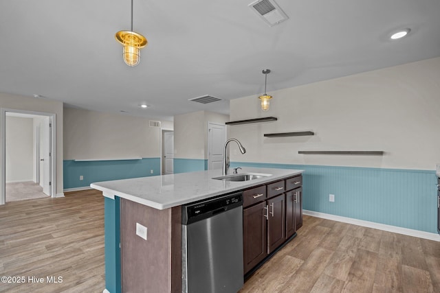 694 Chester Way NE, Leland, NC 28451 - kitchen with dishwasher, light wood-type flooring, a kitchen island with sink, pendant lighting, and a wainscoted wall