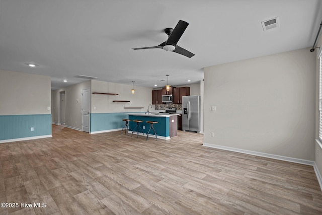 694 Chester Way NE, Leland, NC 28451 - unfurnished living room with ceiling fan, recessed lighting, and light wood finished floors