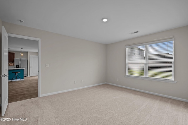 694 Chester Way NE, Leland, NC 28451 - spare room with baseboards and carpet