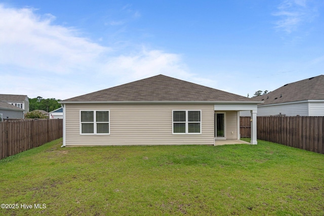 694 Chester Way NE, Leland, NC 28451 - back of house featuring a fenced backyard, a patio area, and a shingled roof